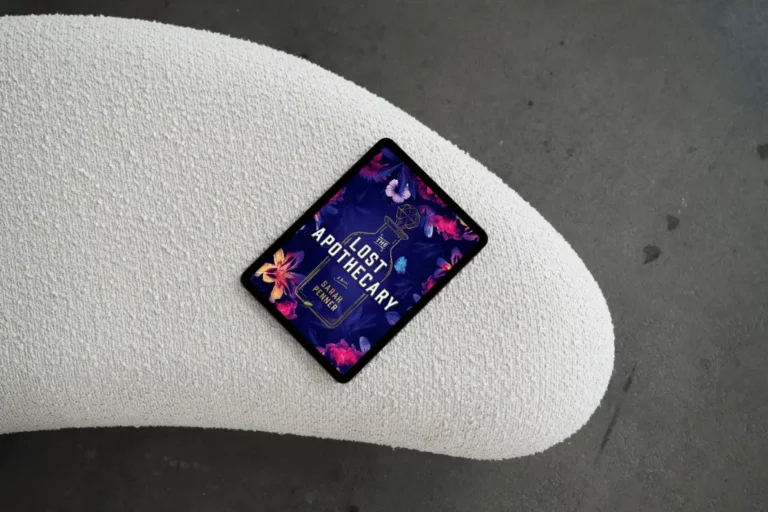 A tablet displaying the book cover of The Lost Apothecary by Sarah Penner resting on a textured white surface